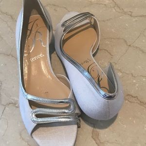 Silver and white dress shoe. Small heals. New